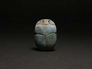 Egyptian heart scarab made of blue frit in the collection of Medusa Art. 