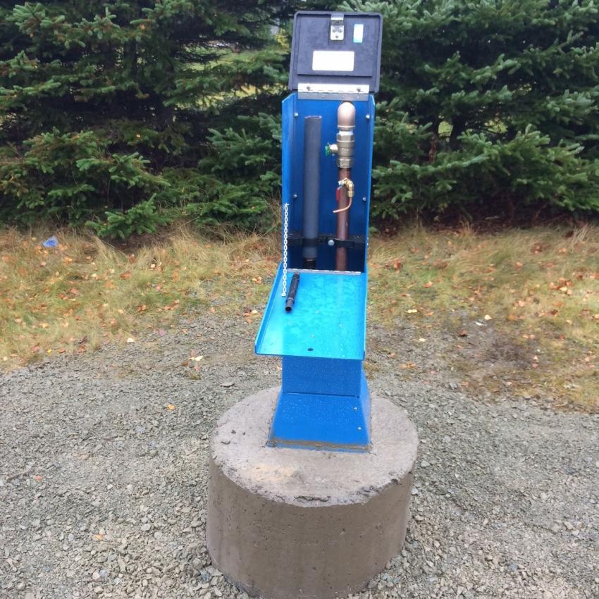 Blue above-ground water-quality sampling station used by utility personnel to collect distribution-line water samples.